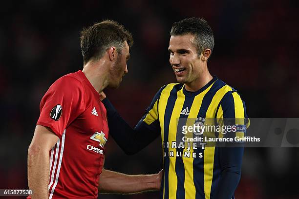 Michael Carrick of Manchester United chats with Robin van Persie of Fenerbahce following the final whistle during the UEFA Europa League Group A...