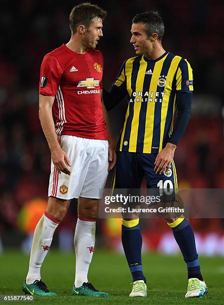 Michael Carrick of Manchester United chats with Robin van Persie of Fenerbahce following the final whistle during the UEFA Europa League Group A...