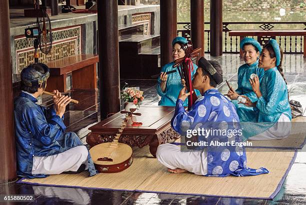 traditional music in the temple. - traditional musician stock pictures, royalty-free photos & images
