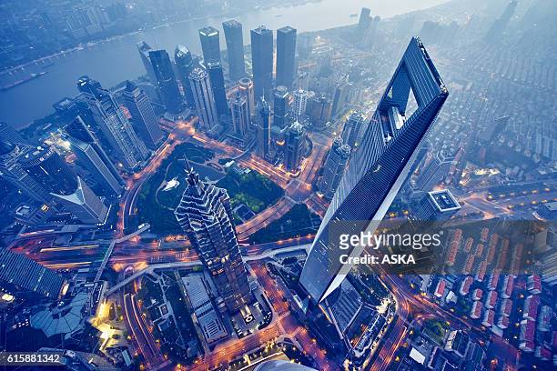 aerial view of shanghai at night - china stock pictures, royalty-free photos & images