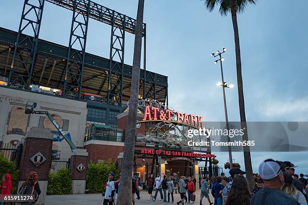crowd of people walking in front of a building - giants baseball stock pictures, royalty-free photos & images