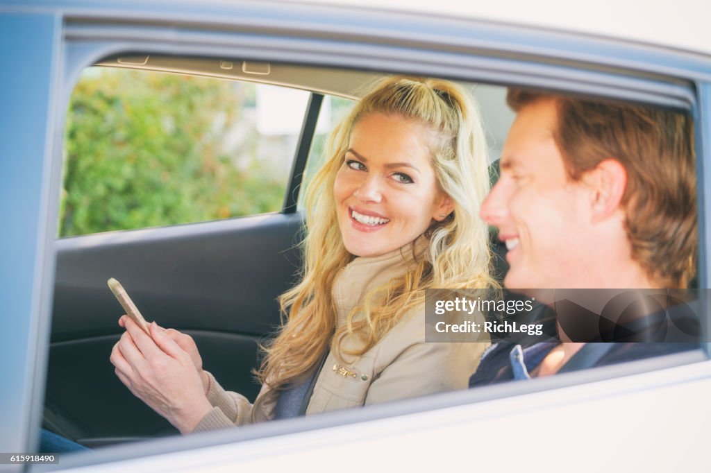 Young Couple in a Ride Share Taxi