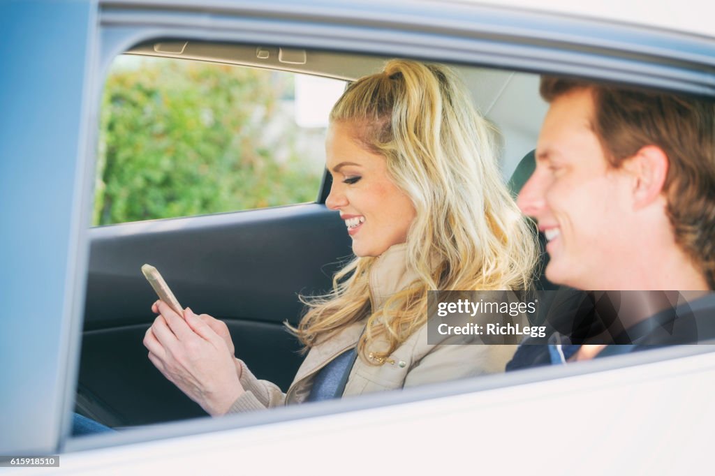 Young Couple in a Ride Share Taxi