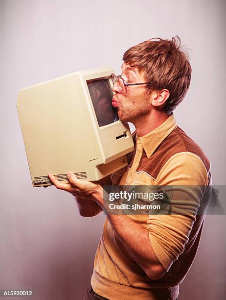 nerd kissing computer - nerd fun stock pictures, royalty-free photos & images