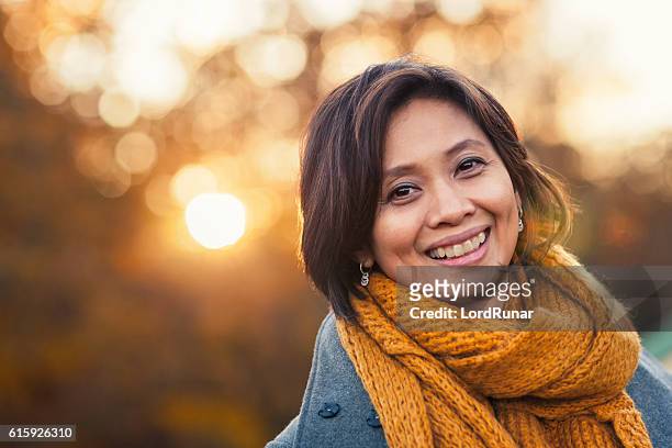 autumn portrait of a woman - mid adult stock pictures, royalty-free photos & images