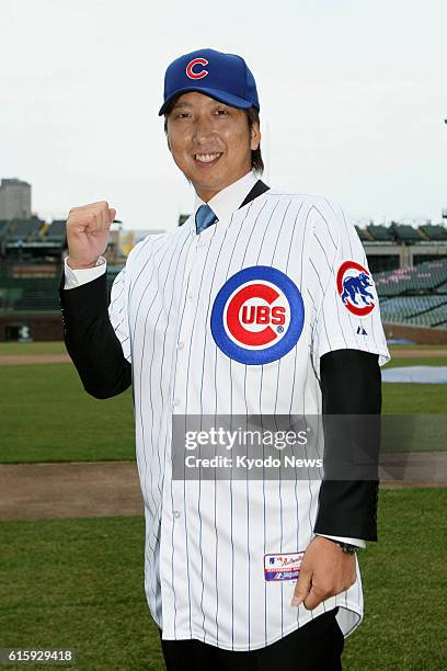 United States - Japanese right-hander Kyuji Fujikawa is pictured in Chicago on Dec. 7 after signing a two-year deal with the Chicago Cubs.