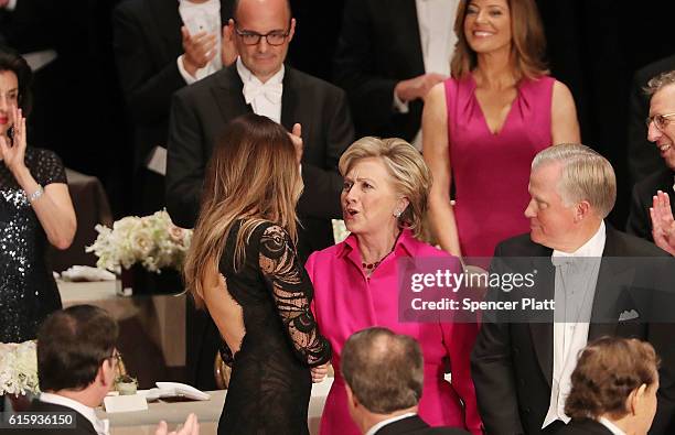 Hillary Clinton speaks with Melania Trump while attending the annual Alfred E. Smith Memorial Foundation Dinner at the Waldorf Astoria on October 20,...