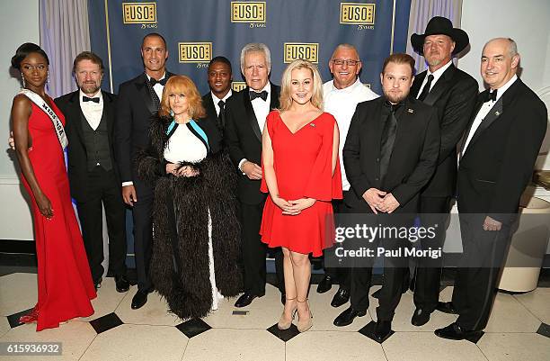 At center, "Jeopardy!" host Alex Trebek makes country music star Kellie Pickler laugh during a group photo with Miss USA Deshauna Barber, Singer...