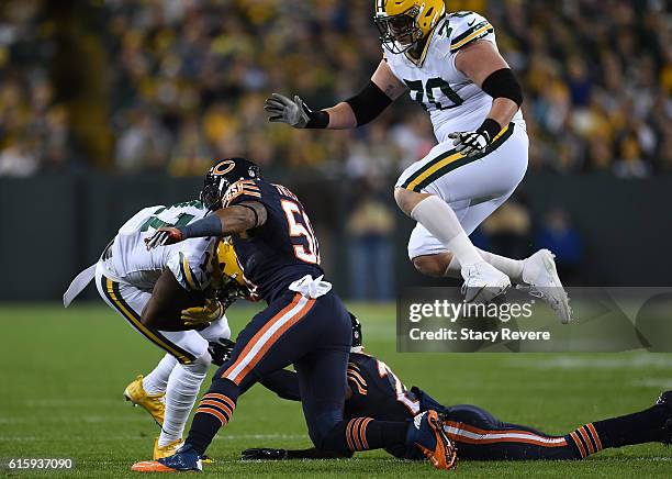 Wide receiver Davante Adams of the Green Bay Packers carries the ball against inside linebacker Jerrell Freeman of the Chicago Bears in the first...