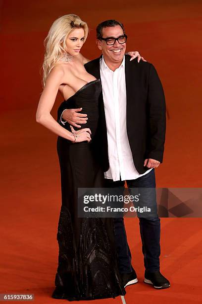 Ria Antoniou and Guillermo Mariotto walk a red carpet for 'Florence Foster Jenkins' during the 11th Rome Film Festival at Auditorium Parco Della...