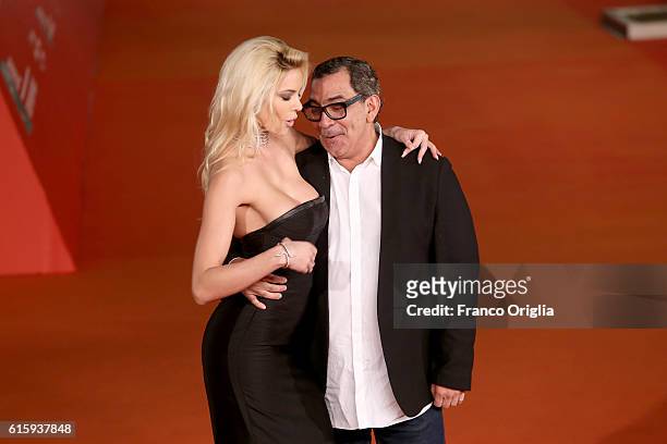 Ria Antoniou and Guillermo Mariotto walk a red carpet for 'Florence Foster Jenkins' during the 11th Rome Film Festival at Auditorium Parco Della...