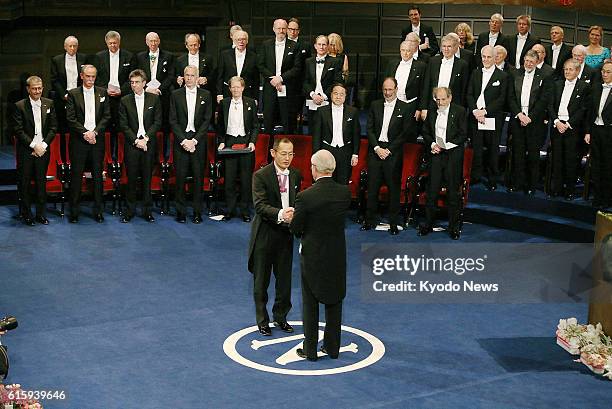 Sweden - Japanese stem cell researcher Shinya Yamanaka , a co-recipient of the 2012 Nobel Prize in medicine, receives his prize from Sweden's King...