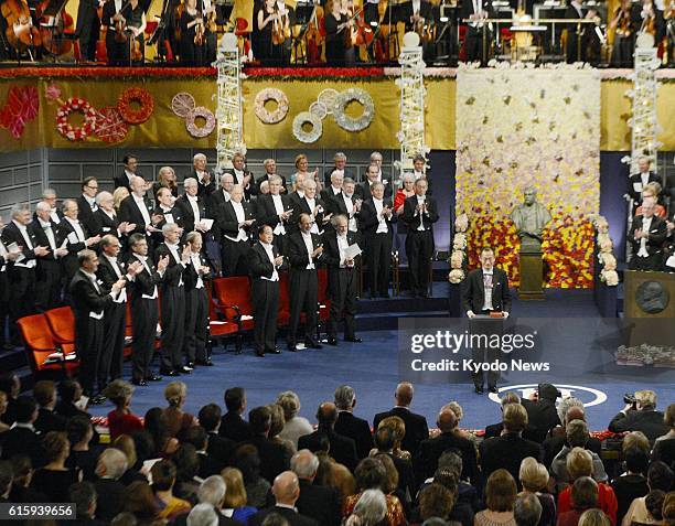 Sweden - Japanese stem cell researcher Shinya Yamanaka , a co-recipient of the 2012 Nobel Prize in medicine, is applauded after receiving his prize...