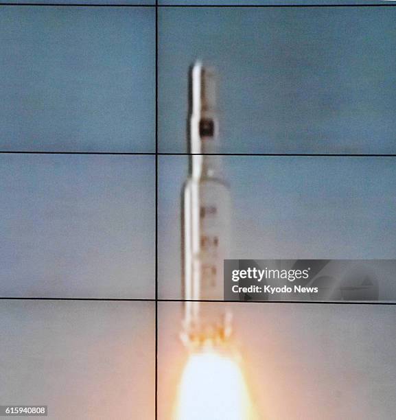 Tongchang-ri, North Korea - Photo of an image on the screen of North Korea's satellite control center shows a rocket, following its launch from the...