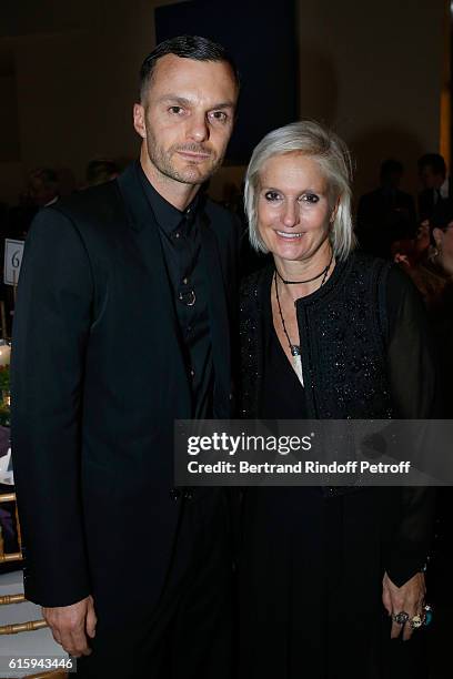 Stylist Kris Van Assche and Maria Grazia Chiuri attend the "Icones de l'Art Moderne, La Collection Chtchoukine" : Cocktail at Fondation Louis Vuitton...