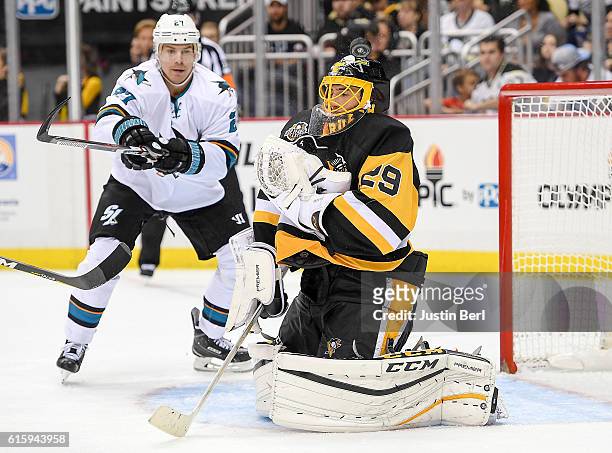 Marc-Andre Fleury of the Pittsburgh Penguins makes the save against the San Jose Sharks in the third period during the game at PPG PAINTS Arena on...