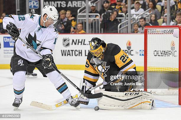 Marc-Andre Fleury of the Pittsburgh Penguins makes the save against Patrick Marleau of the San Jose Sharks in the third period during the game at PPG...