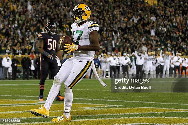 Wide receiver Davante Adams of the Green Bay Packers scores a fourth quarter touchdown past inside linebacker Jerrell Freeman of the Chicago Bears at...