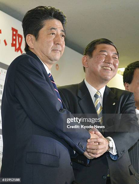 Japan - Former Prime Minister Shinzo Abe , head of Japan's main opposition Liberal Democratic Party, and Shigeru Ishiba, the party's secretary...