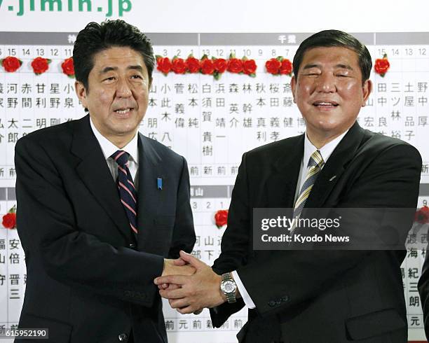 Japan - Former Prime Minister Shinzo Abe , head of Japan's main opposition Liberal Democratic Party, and Shigeru Ishiba, the party's secretary...