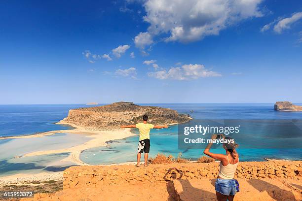 tourists at balos beach, crete - percussion instrument stock pictures, royalty-free photos & images