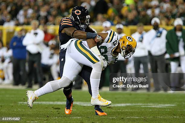 Tight end Richard Rodgers of the Green Bay Packers is tackled by inside linebacker Jerrell Freeman of the Chicago Bears in the fourth quarter at...