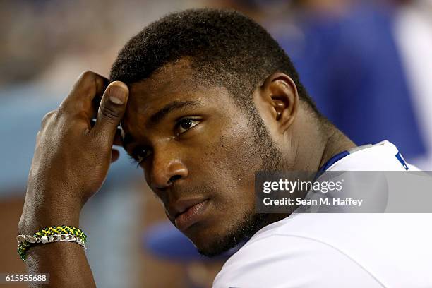 Yasiel Puig of the Los Angeles Dodgers reacts from the dugout while taking on the Chicago Cubs in game five of the National League Division Series at...