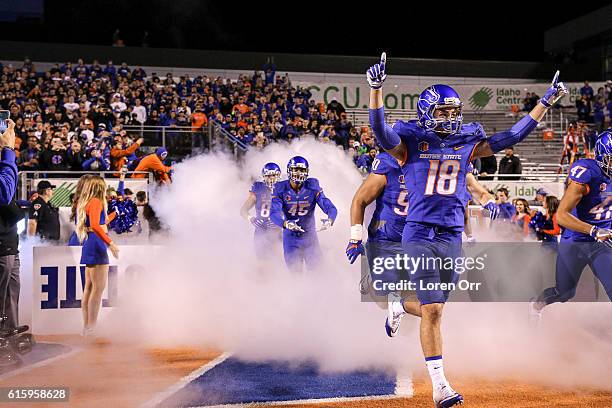 Wide receiver Bubba Ogbebor of the Boise State Broncos leads a group of teammates out of the tunnel prior to the start of action between the Brigham...