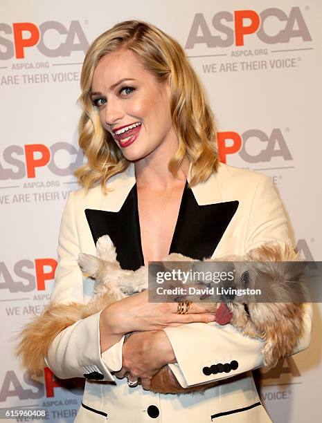 Actress Beth Behrs and Marnie the Dog arrive at the ASPCA Benefit at Private Residence on October 20, 2016 in Los Angeles, California.