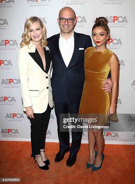 Actress Beth Behrs, ASPCA President and CEO Matt Bershadker, and actress Sarah Hyland arrive at the ASPCA Benefit at Private Residence on October 20,...