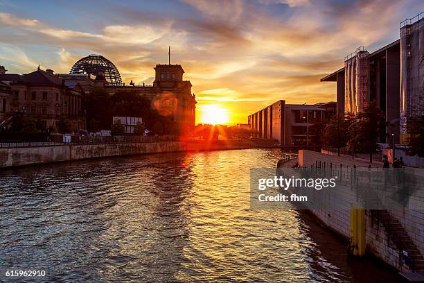 reichstag building berlin, near spree river in a nice sunset - reichstag stock-fotos und bilder