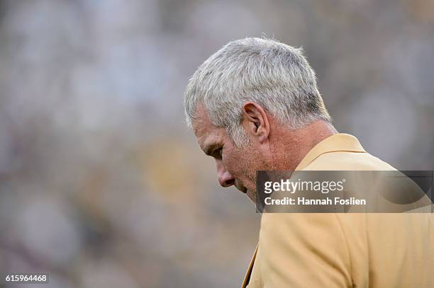 Former NFL quarterback Brett Farve looks on as he is inducted into the Ring of Honor during a halftime ceremony during the game between the Green Bay...