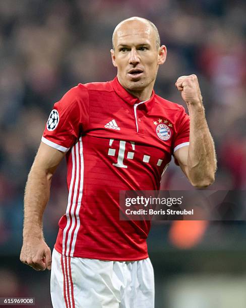 Arjen Robben of FC Bayern Muenchen celebrates after Robert Lewandowski of FC Bayern Muenchen scores his team's third goal during the UEFA Champions...