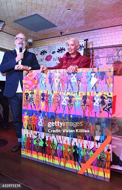 Creative director of Flirt Cosmetics Donald Robertson and Amber Rose attend Flirt Cosmetics x Amber Rose Event on October 20, 2016 in Los Angeles,...