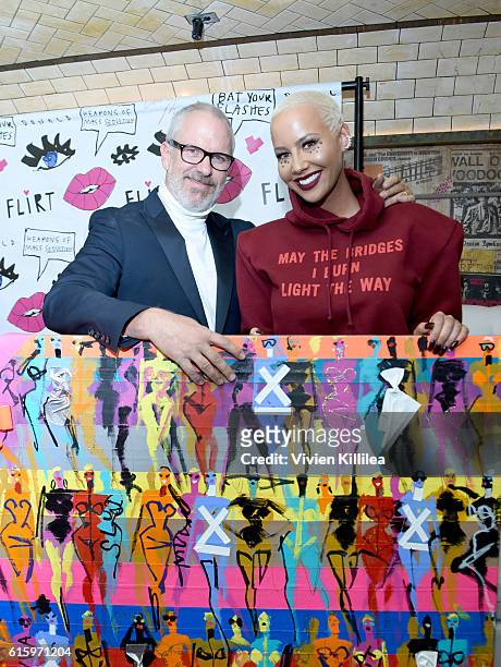 Creative director of Flirt Cosmetics Donald Robertson and Amber Rose attend Flirt Cosmetics x Amber Rose Event on October 20, 2016 in Los Angeles,...