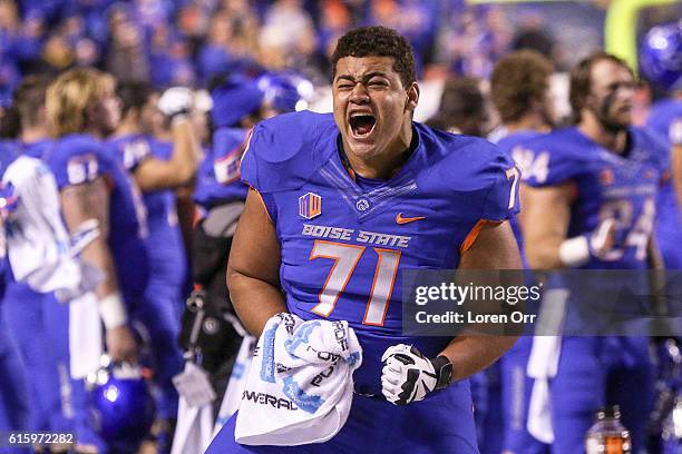 Offensive lineman Donte Harrington of the Boise State Broncos celebrates a hard fought victory at the conclusion of the game against the Brigham...