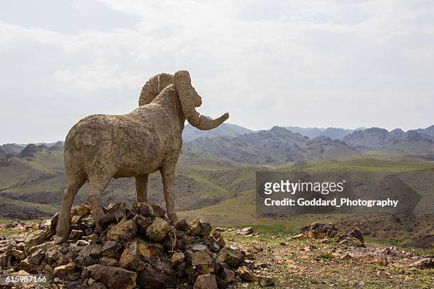 mongolia: hilltop statue at khanbogd ger camp - argali stock pictures, royalty-free photos & images