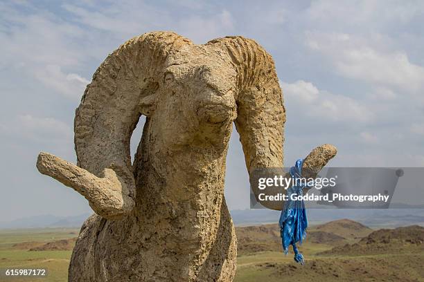 mongolia: hilltop statue at khanbogd ger camp - argali stock pictures, royalty-free photos & images