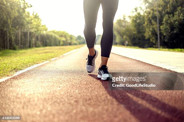 running on tracks - walking stock pictures, royalty-free photos & images