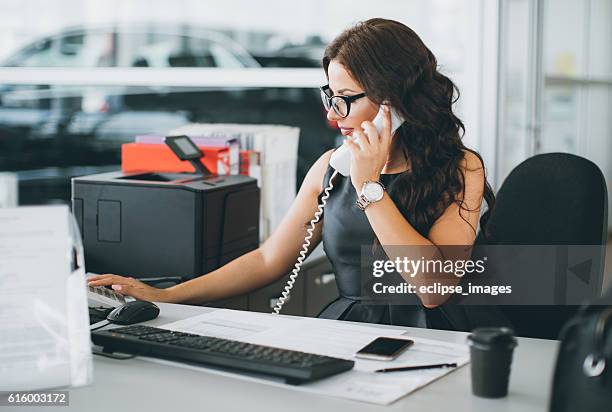 secretary at car dealership - secretariat stock pictures, royalty-free photos & images