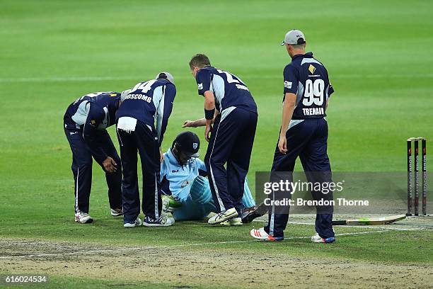 Peter Siddle of the Bushrangers checks Daniel Hughes of the Blues after being struck on the helmet by a short delivery during the Matador BBQs One...