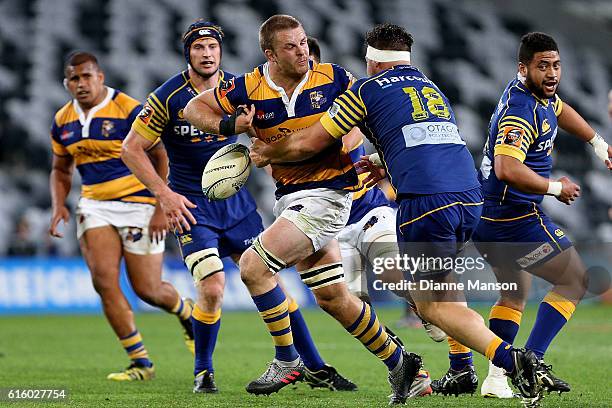 Sam Cane of Bay of Plenty fends off Josh Hohneck of Otago during the Mitre 10 Cup Championship Semi Final between Otago and Bay of Plenty on October...