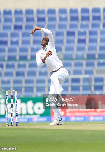 Roston Chase bowls during Day One of the Second Test between Pakistan and the West Indies at the Zayed Cricket Stadium on October 21, 2016 in Abu...