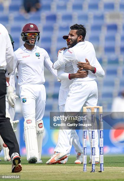 Devendra Bishoo celebrates bowling Sami Aslam during Day One of the Second Test between Pakistan and the West Indies at the Zayed Cricket Stadium on...