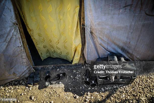 Bar Elias, Lebanon Dirty shoes lie in a box in front of the entrance of a tent in a refugee camp in the Bekaa plain on October 06, 2016 in Bar Elias,...
