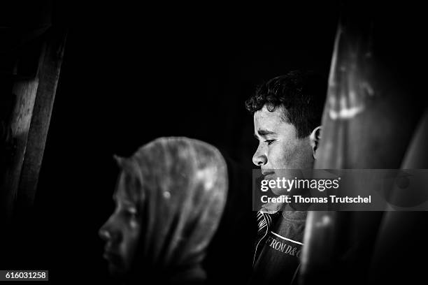 Bar Elias, Lebanon Syrian youths are standing at the entrance of a tent in a refugee camp in the Bekaa plain on October 06, 2016 in Bar Elias,...