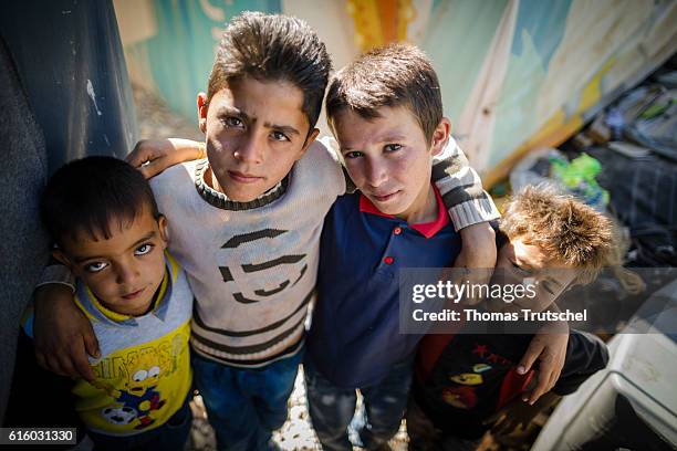 Bar Elias, Lebanon Four Syrian boys posing in a refugee camp in the Bekaa plain for a photo on October 06, 2016 in Bar Elias, Lebanon.