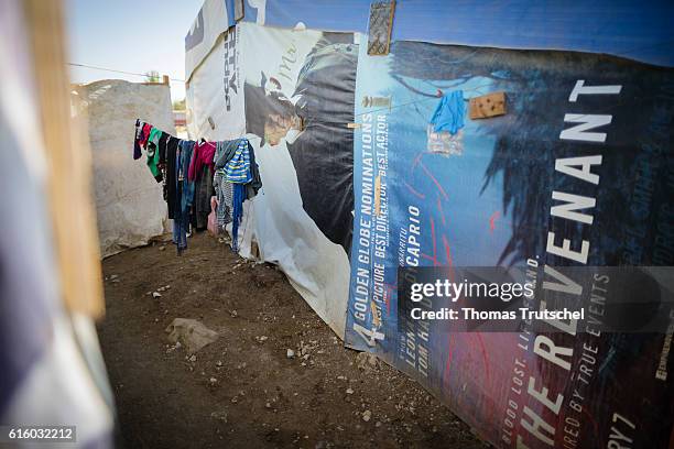 Bar Elias, Lebanon Laundry dries in a refugee camp in the Bekaa plain, next to a tent built of old movie posters on October 06, 2016 in Bar Elias,...