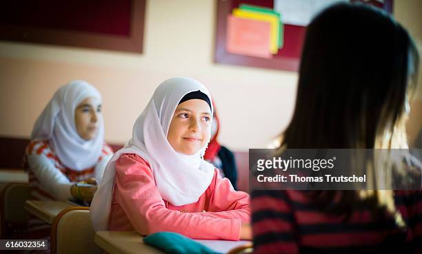 Nizip, Turkey Syrian girls sit in a girls school of an AFAD refugee camp on school benches on October 07, 2016 in Nizip, Turkey.