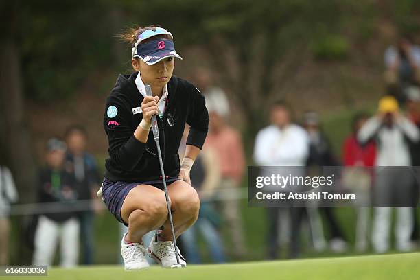 Chie Arimura of Japan lines up her putt on the 1st hole during the third round of the Nobuta Group Masters GC Ladies at the Masters Golf Club on...